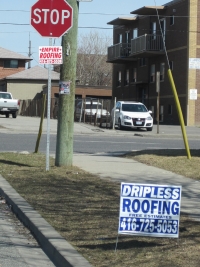 Bandit roofing signs = Littering