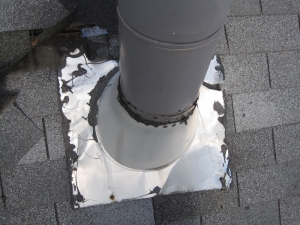 Inappropriate installation of chimney flashing leading to leaks.